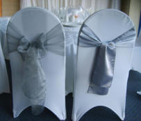 One style of chair cover with example silver Organza and Satin sashes