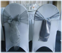 One style of chair cover with example silver Organza and Satin sashes